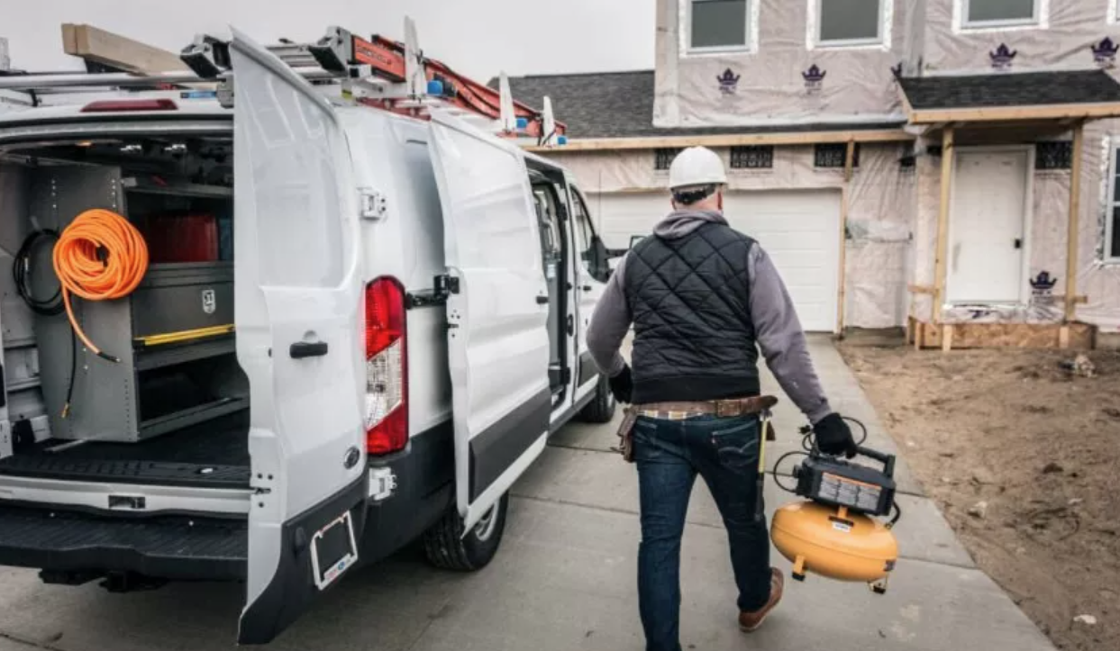 HVAC service van parked outside a residential home