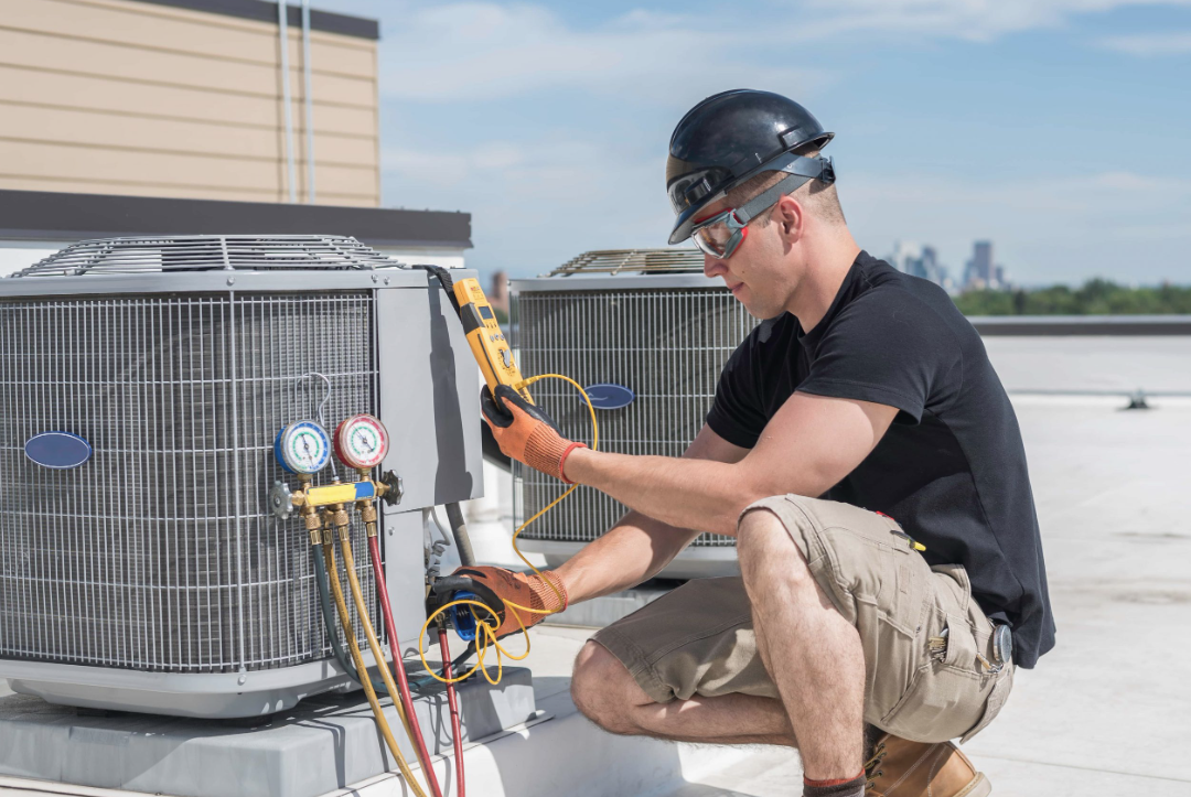HVAC technician performing a residential service call